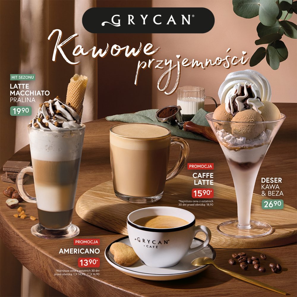 Filiżanki z kawą Americano i Caffe Latte, wysoka szklanka z Latte Macchiato Pralina oraz deser Kawa i Beza na drewnianym stole z logo Grycan w Pasażu Grunwaldzkim we Wrocławiu